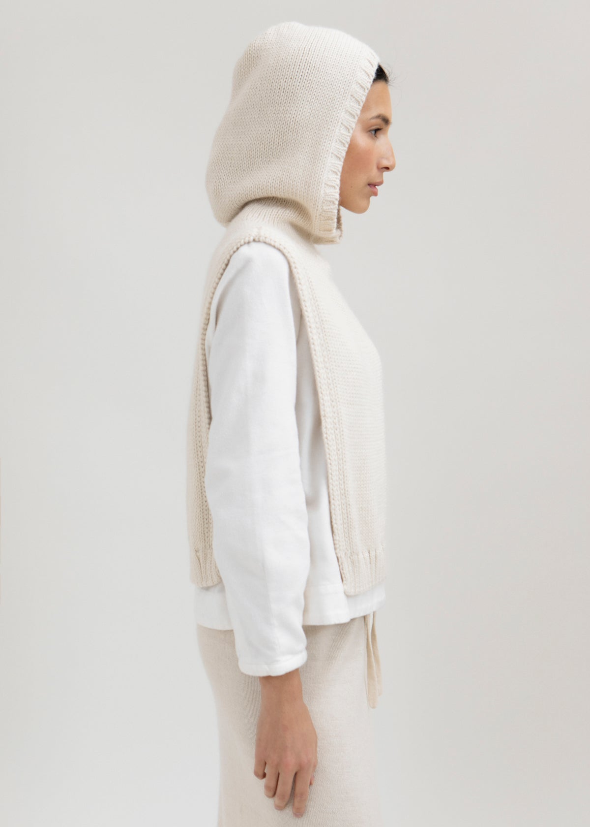Tofino Poncho in Cream, baby alpaca mini poncho by Ahblo, worn by model