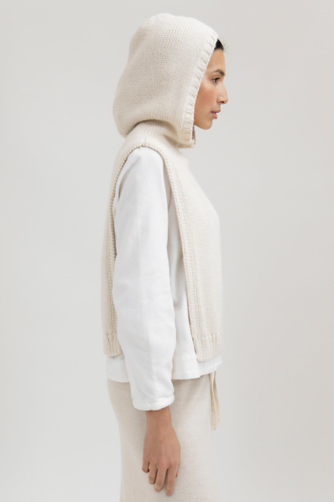 Tofino Poncho in Cream, baby alpaca mini poncho by Ahblo, worn by model