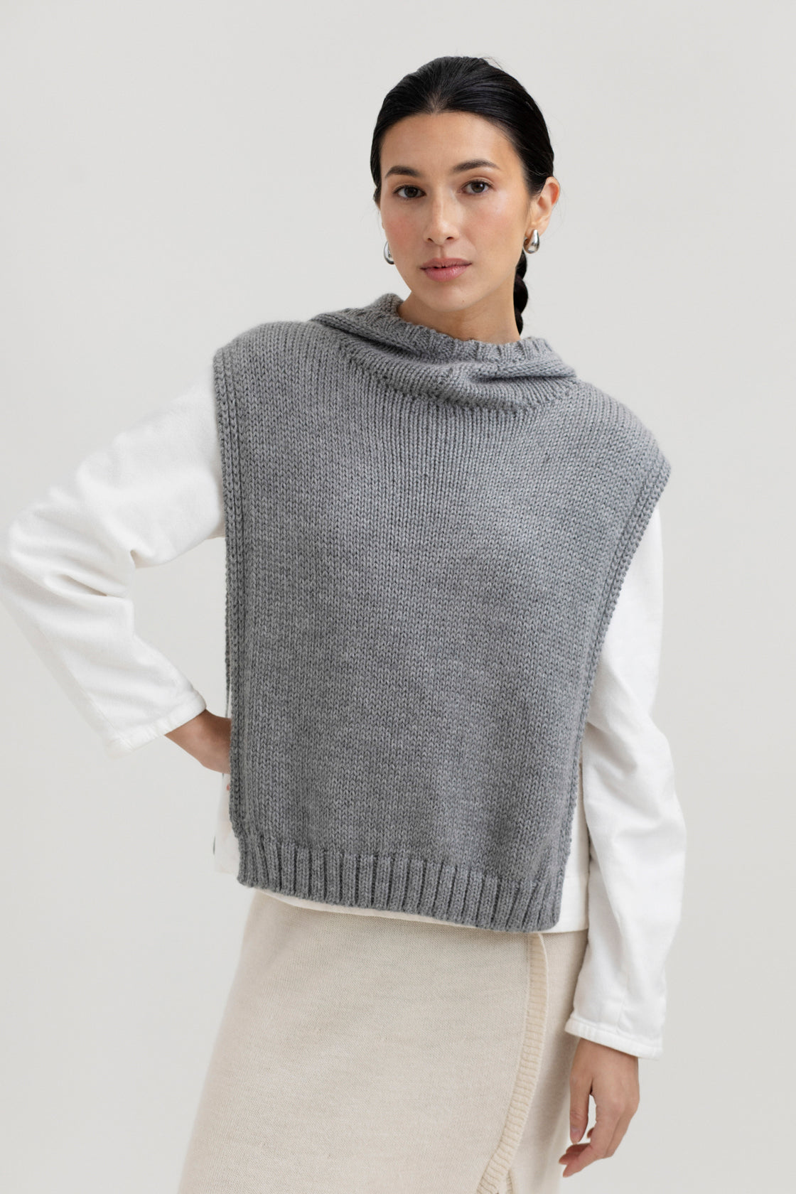 Tofino Poncho in Mist Grey, baby alpaca mini poncho by Ahblo, worn by model