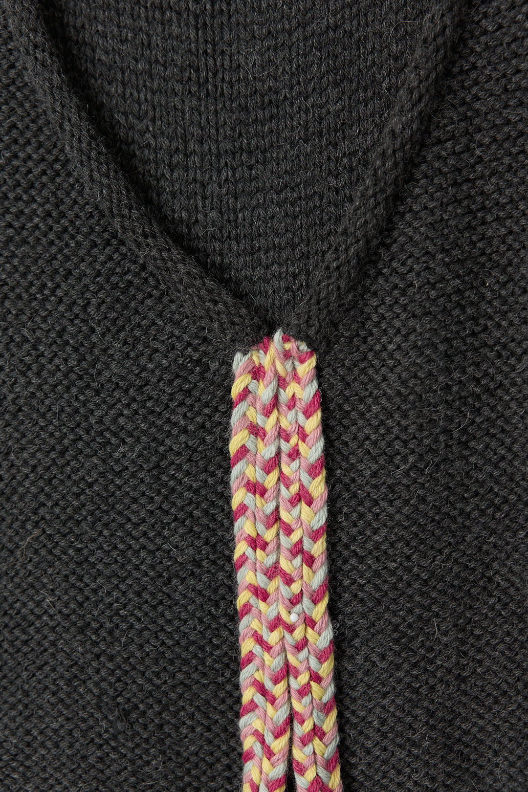 Vela Braid Vest in Charcoal, baby alpaca knit vest with hand-braided trim by Ahblo, flat lay