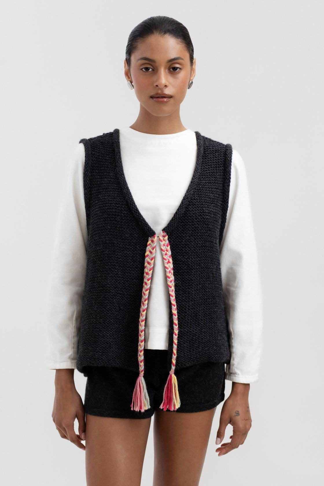 Vela Braid Vest in Charcoal, baby alpaca knit vest with hand-braided trim by Ahblo, worn by model