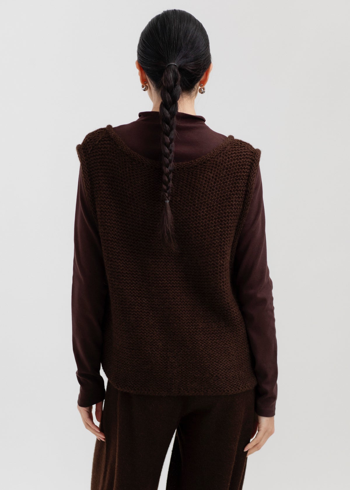 Vela Braid Vest in Chocolate Brown, baby alpaca knit vest with hand-braided trim by Ahblo, worn by model