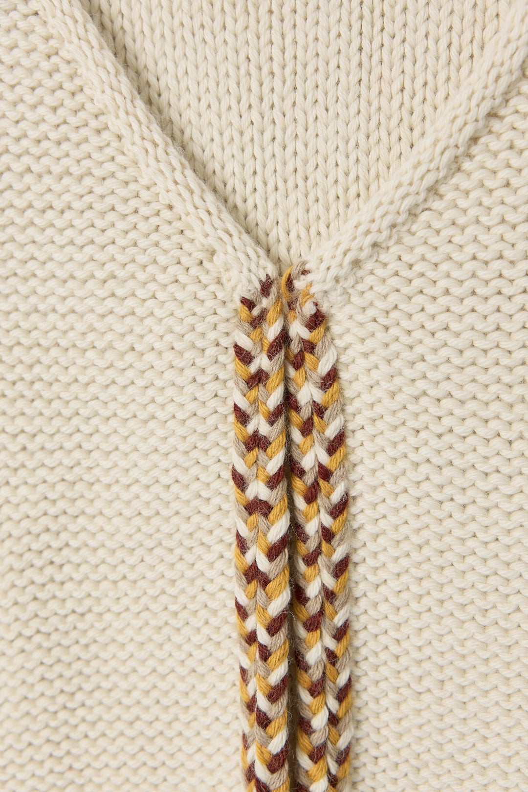 Vela Braid Vest in Ivory, baby alpaca knit vest with hand-braided trim by Ahblo, flat lay