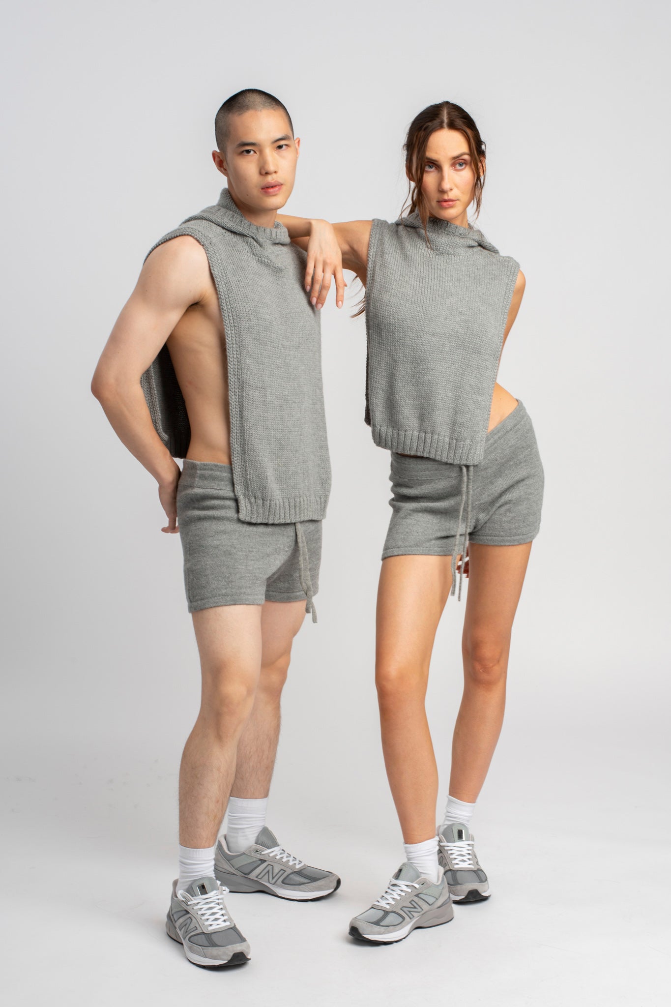 Models wearing knitwear alpaca wool light grey shorts, standing
