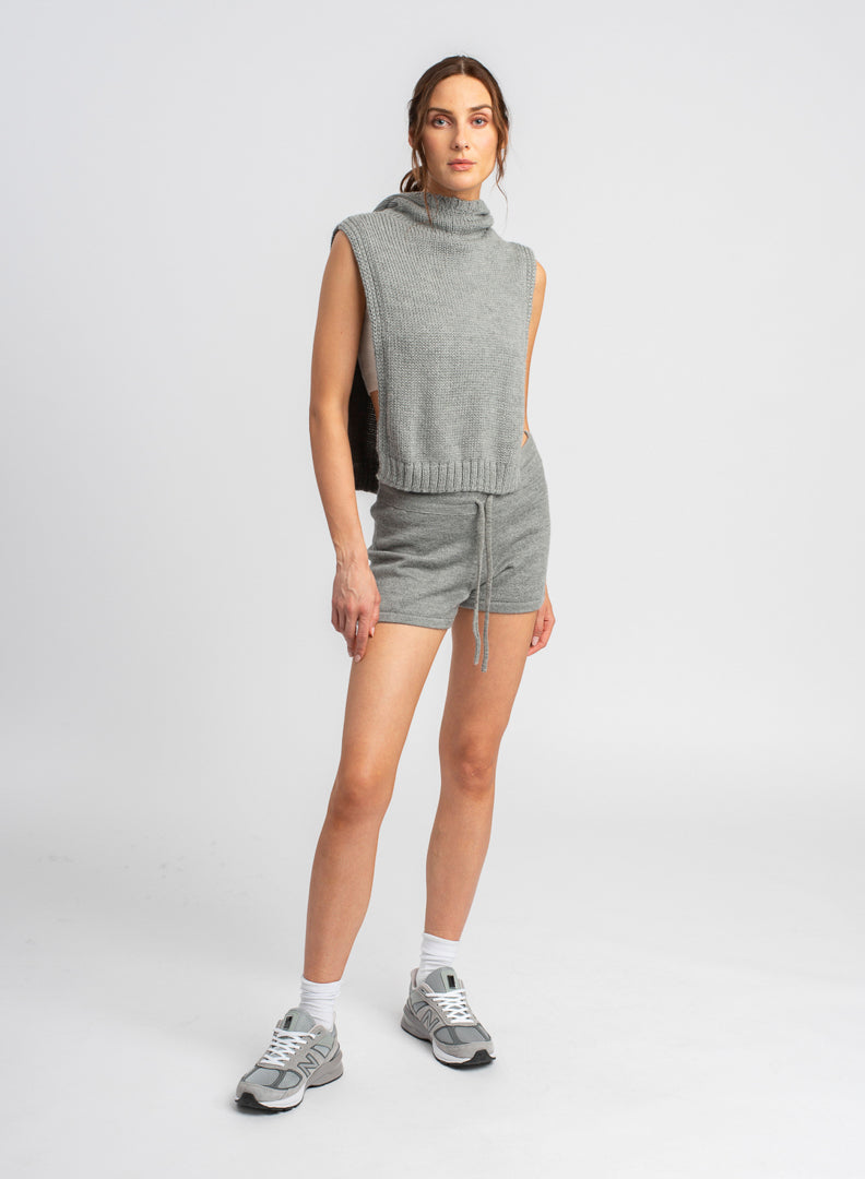 Model wearing knitwear alpaca wool light grey shorts & matching top, front view