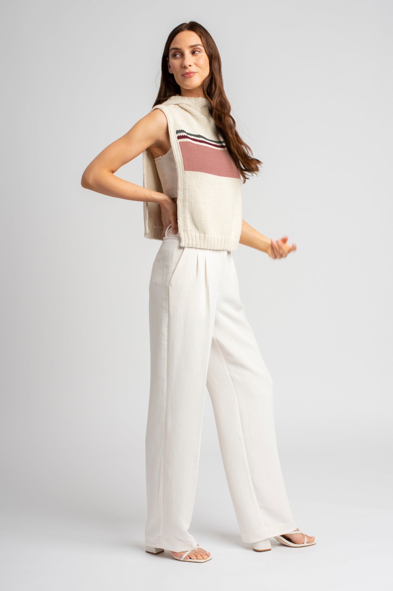 Model wearing poncho in pink baby alpaca wool