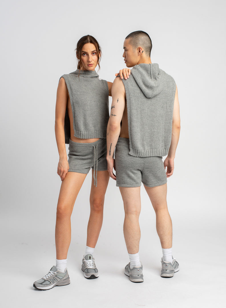 Two models wearing poncho in light grey alpaca wool, front and back view