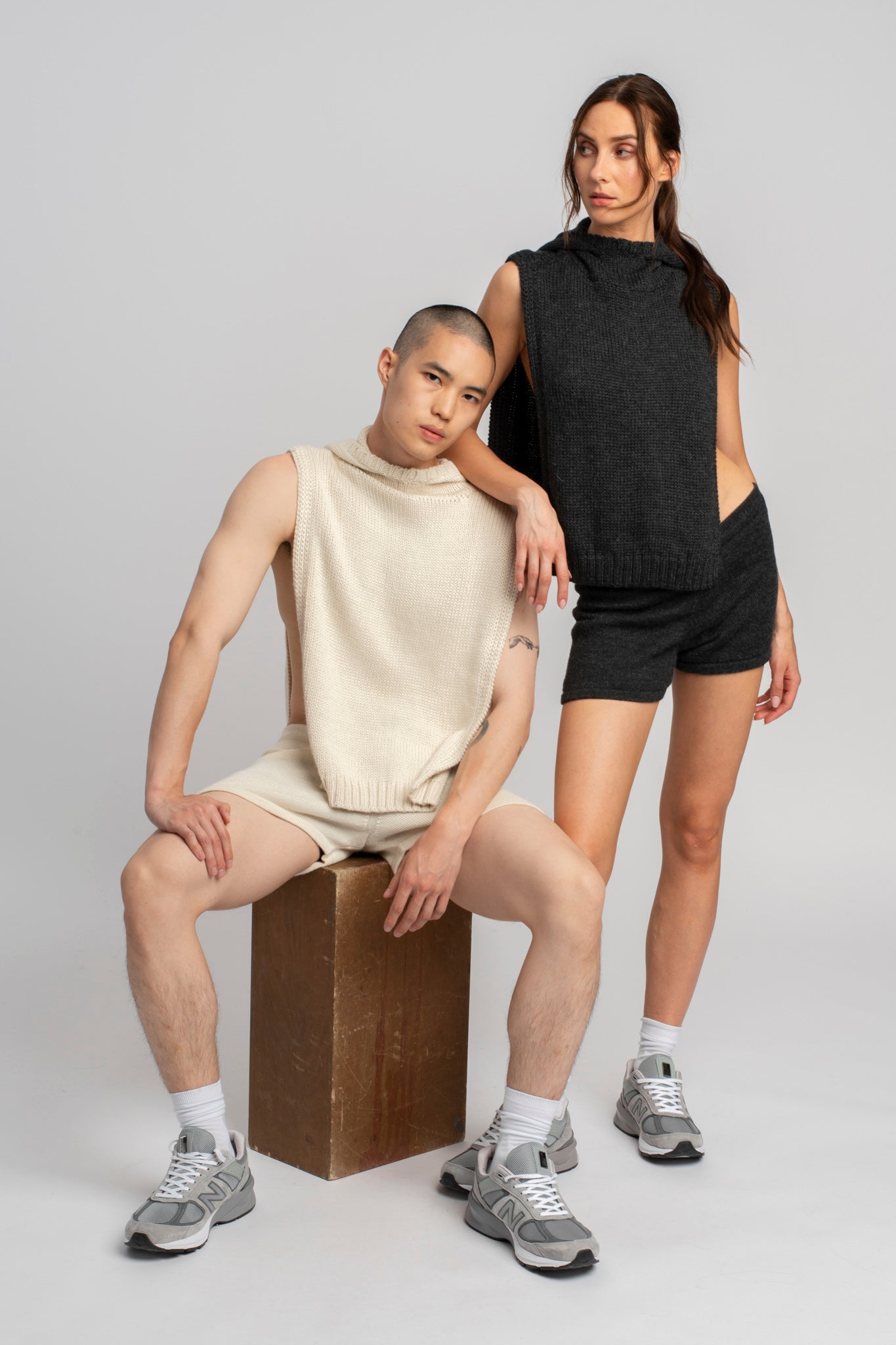 Two models wearing poncho in white and dark grey alpaca wool, front