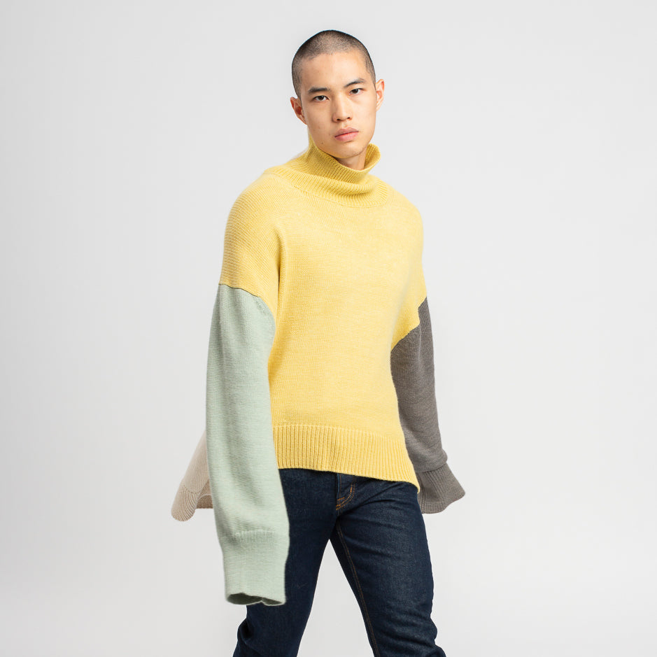 Model wearing Oversized Sweater in Multi-Color Yellow