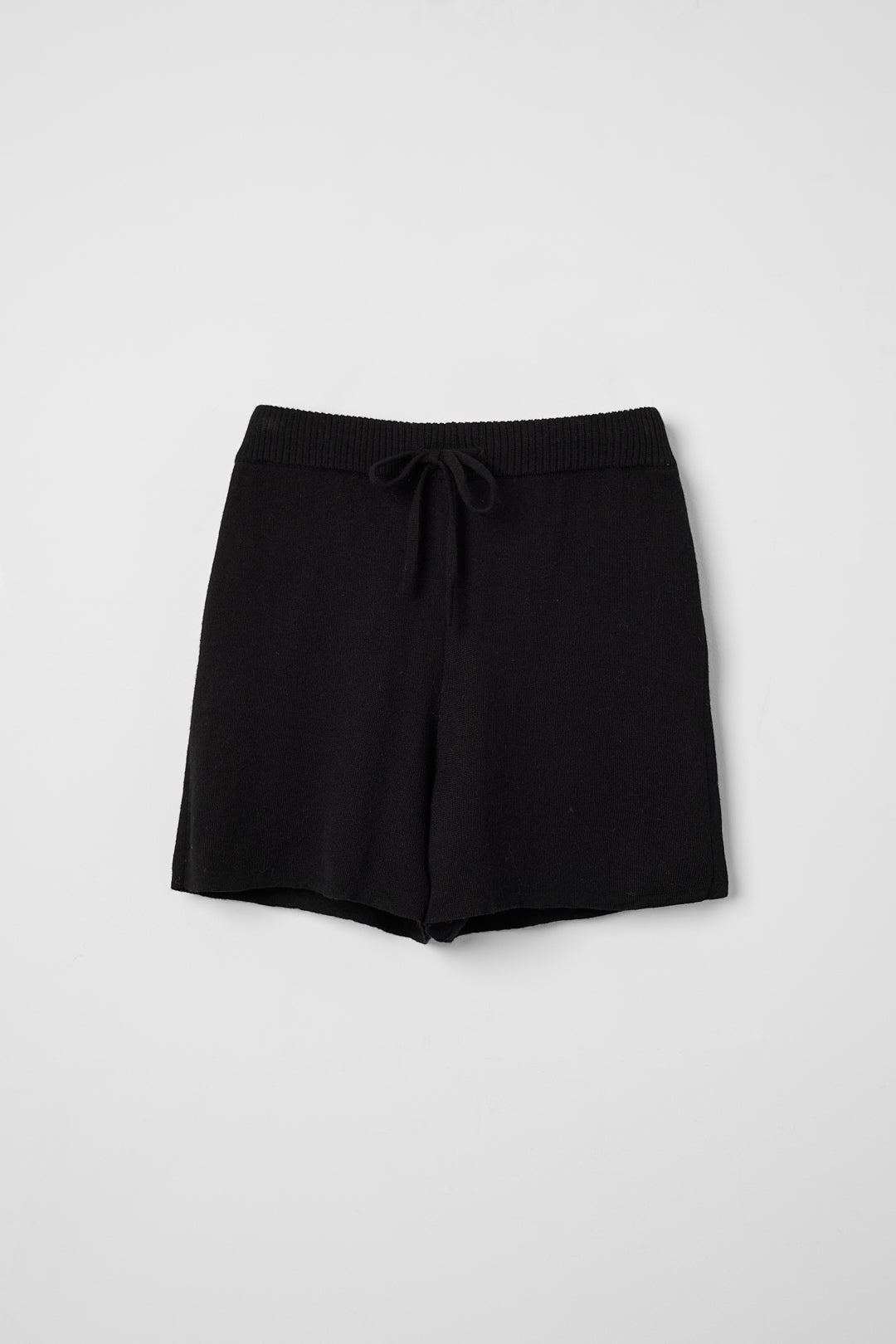 Airy Shorts in Black, alpaca and silk knit shorts by Ahblo, flat lay