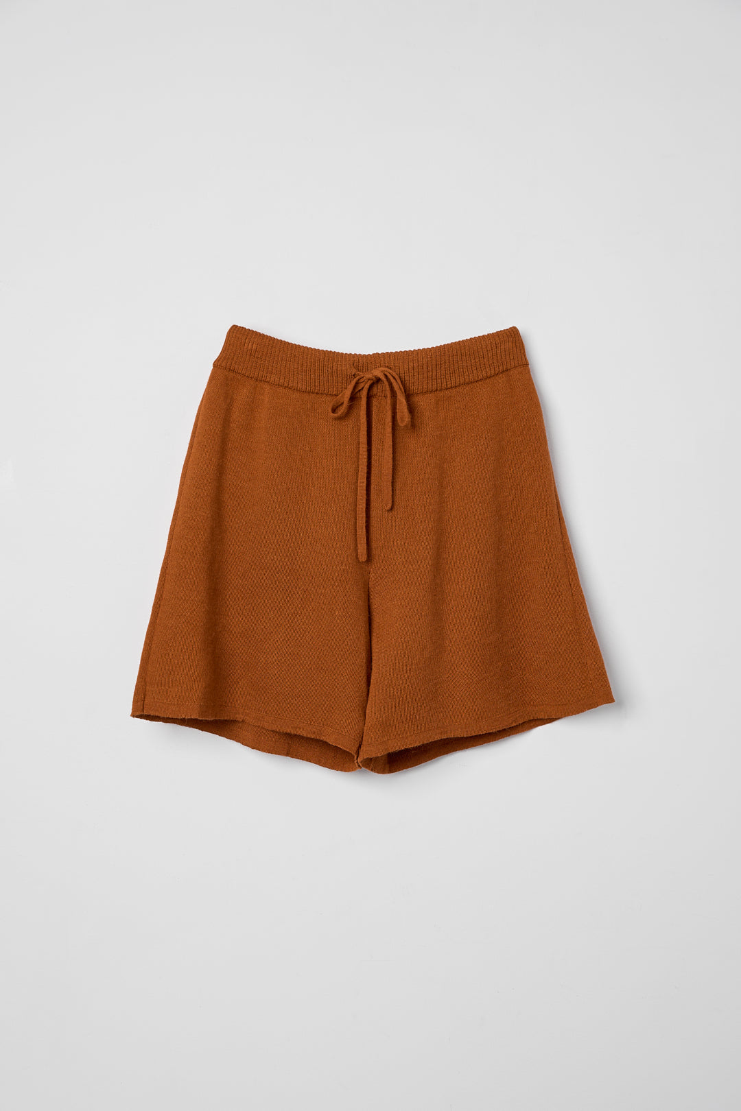 Airy Shorts in Burnt Orange, alpaca and silk knit shorts by Ahblo, flat lay