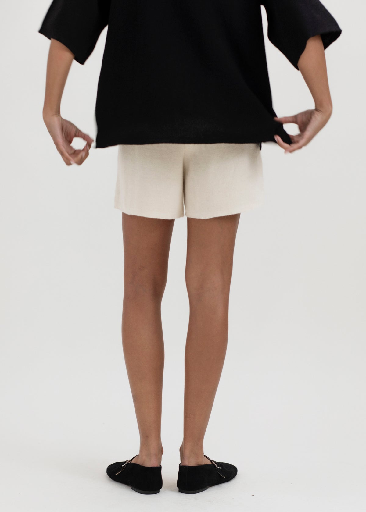 Airy Shorts in Cream, alpaca and silk knit shorts by Ahblo, worn by model