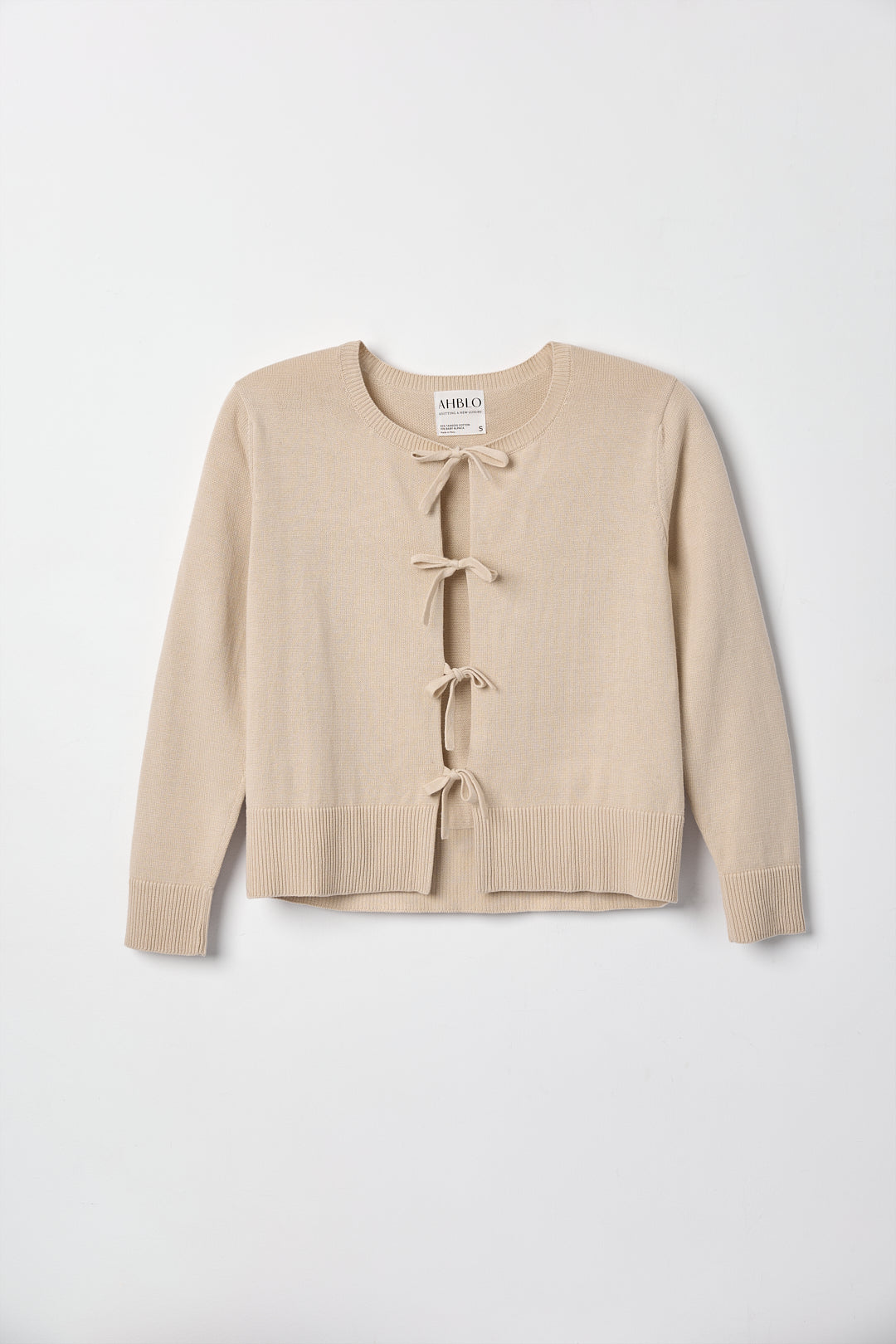 Amaya Cardigan in Praline, cotton and baby alpaca bow cardigan by Ahblo, flat lay
