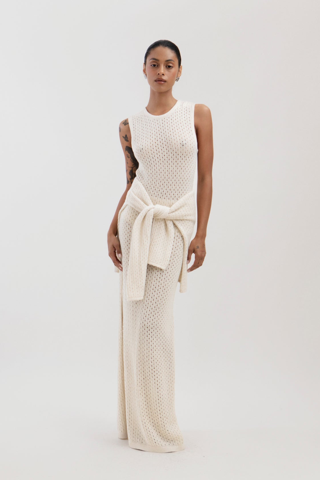 Aurora Dress in Cream, baby alpaca knit maxi dress by Ahblo, worn by model