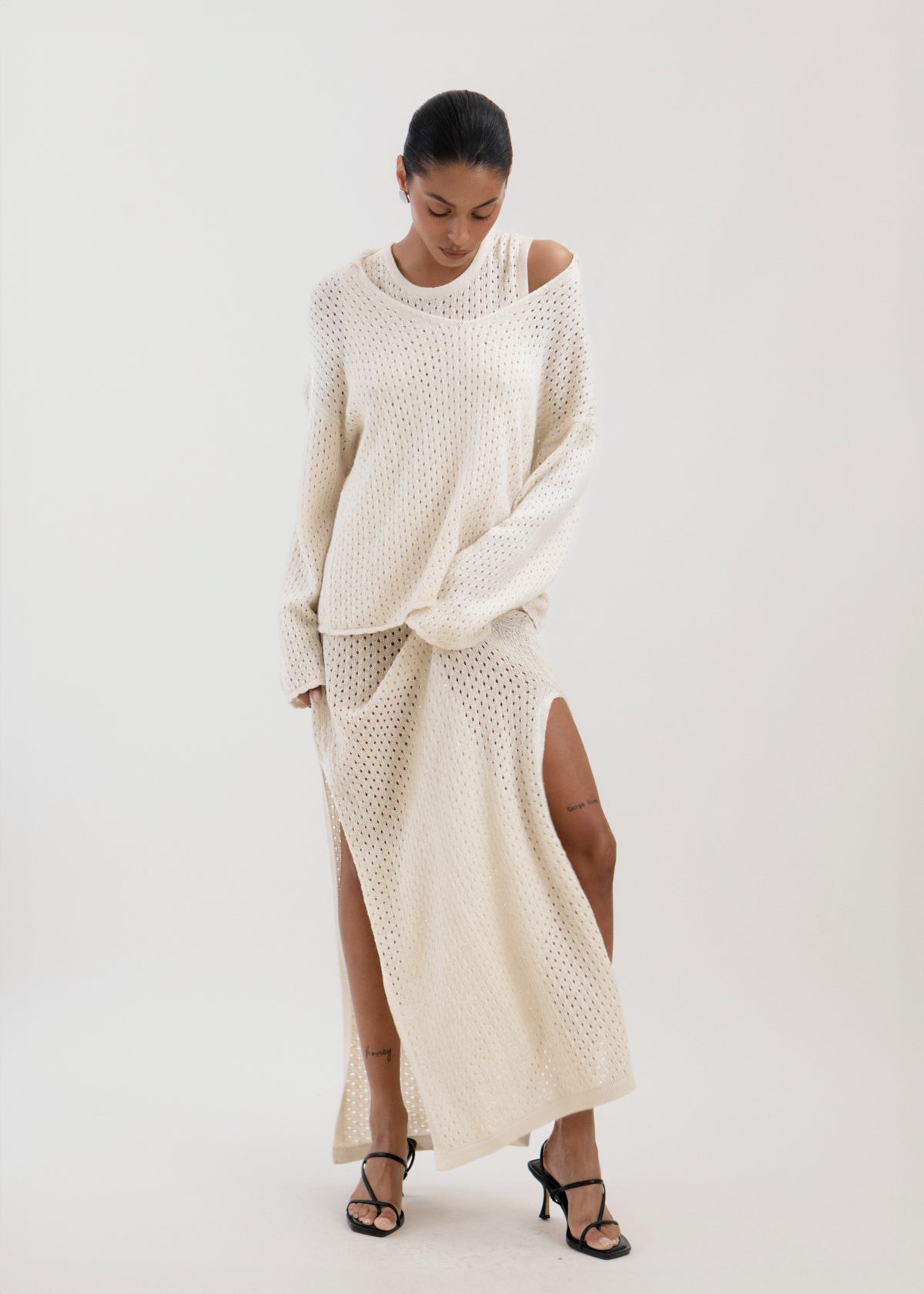 Aurora Dress in Cream, baby alpaca knit maxi dress by Ahblo, worn by model