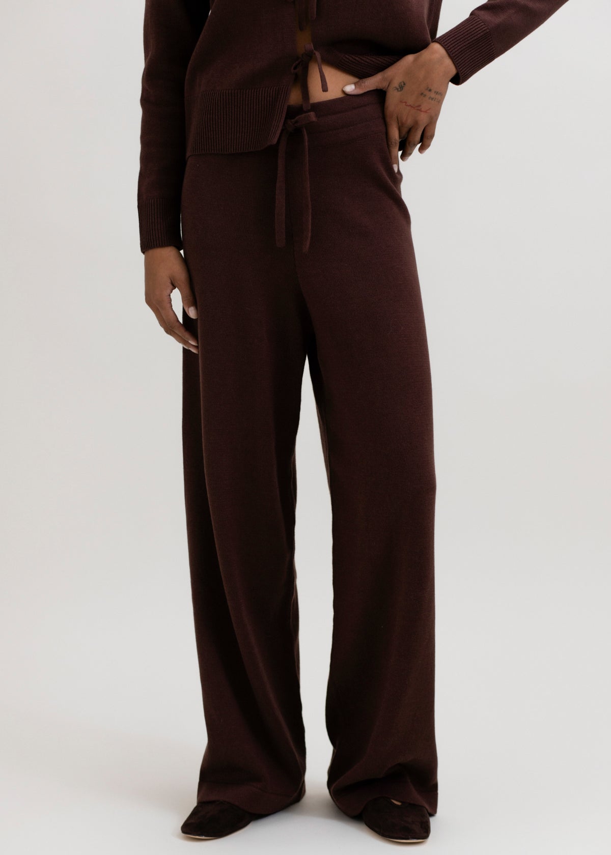 Avery Trousers in Chocolate Brown, baby alpaca wide-leg knit trousers by Ahblo, worn by model