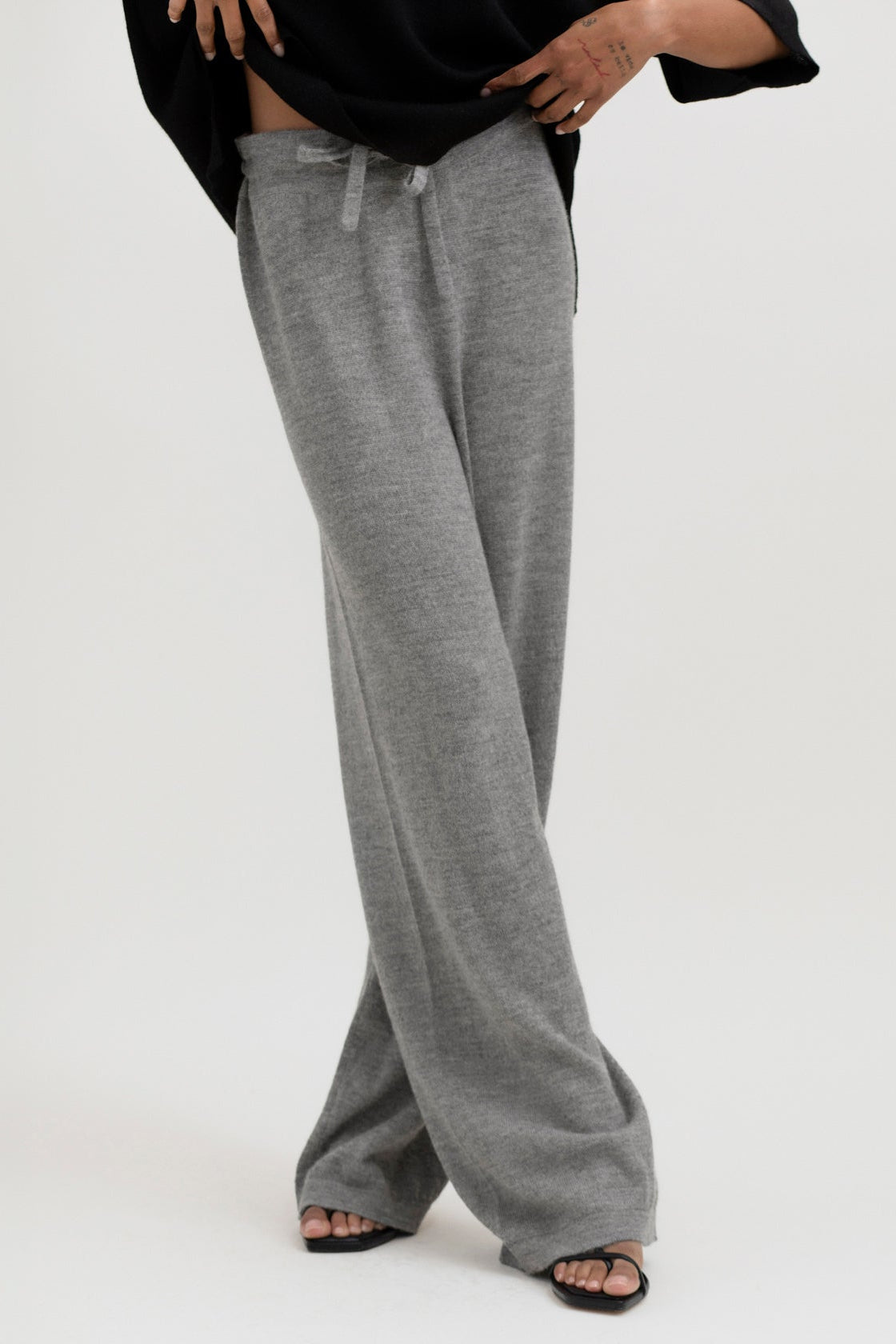 Avery Trousers in Mist Grey, baby alpaca wide-leg knit trousers by Ahblo, worn by model