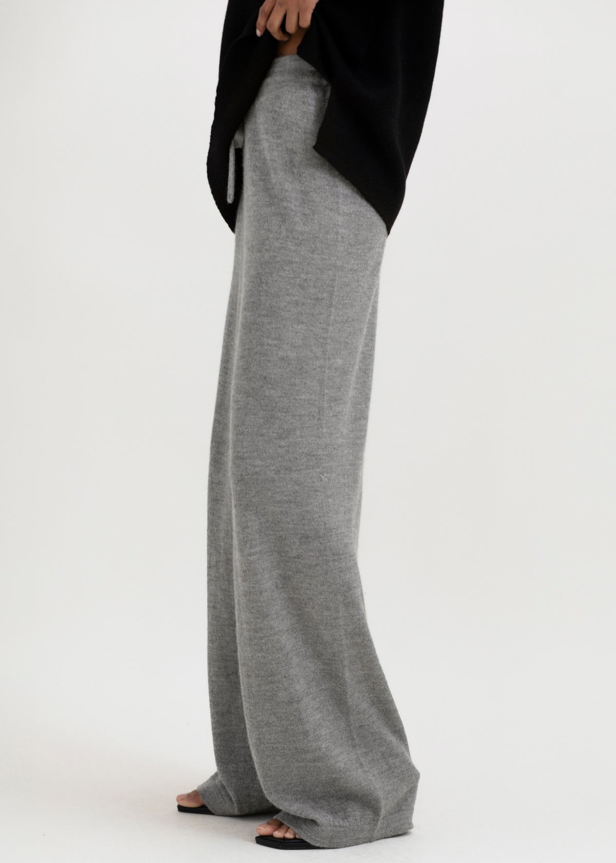 Avery Trousers in Mist Grey, baby alpaca wide-leg knit trousers by Ahblo, worn by model