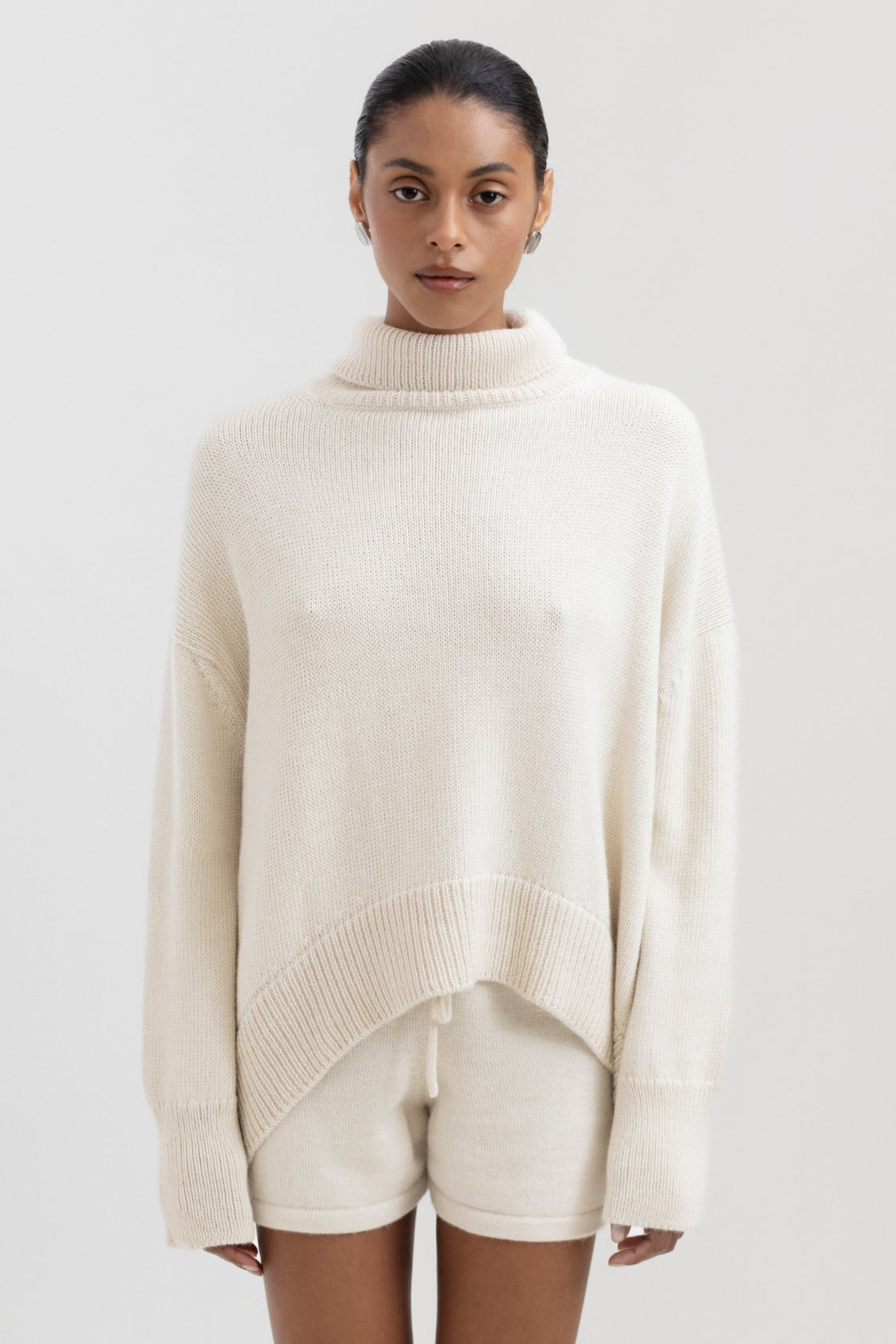 Cedar Sweater in Cream, oversized baby alpaca turtleneck sweater by Ahblo, worn by model