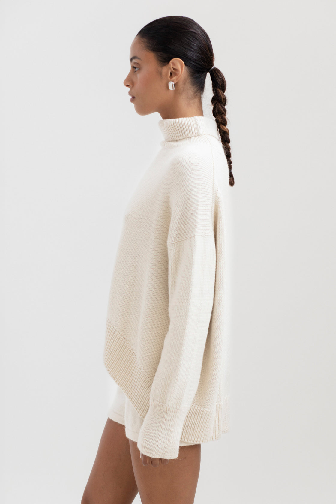 Cedar Sweater in Cream, oversized baby alpaca turtleneck sweater by Ahblo, worn by model