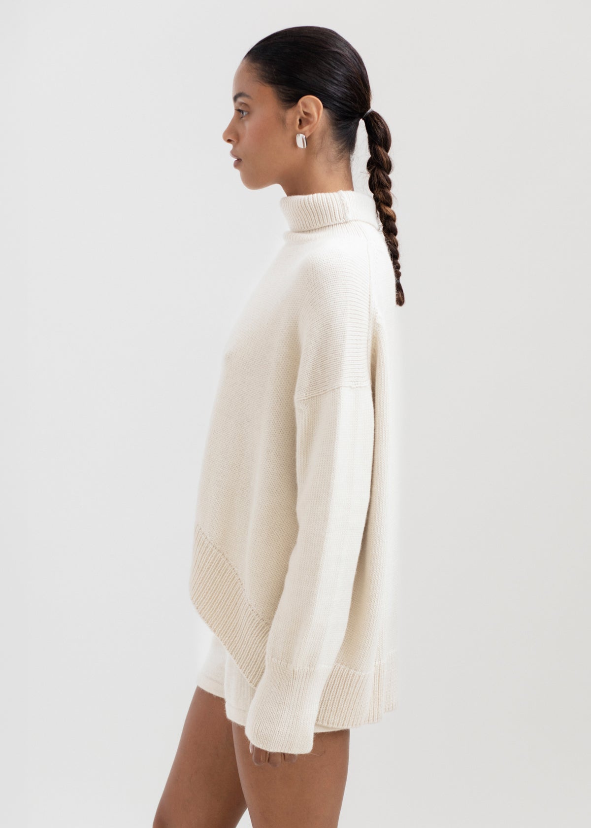 Cedar Sweater in Cream, oversized baby alpaca turtleneck sweater by Ahblo, worn by model