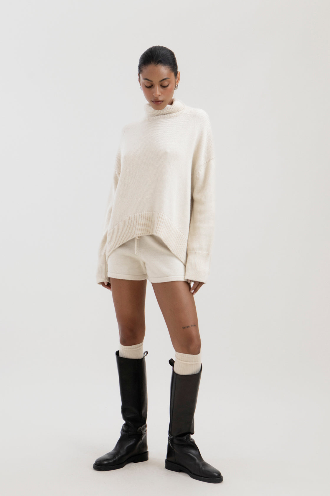 Cedar Sweater in Cream, oversized baby alpaca turtleneck sweater by Ahblo, worn by model