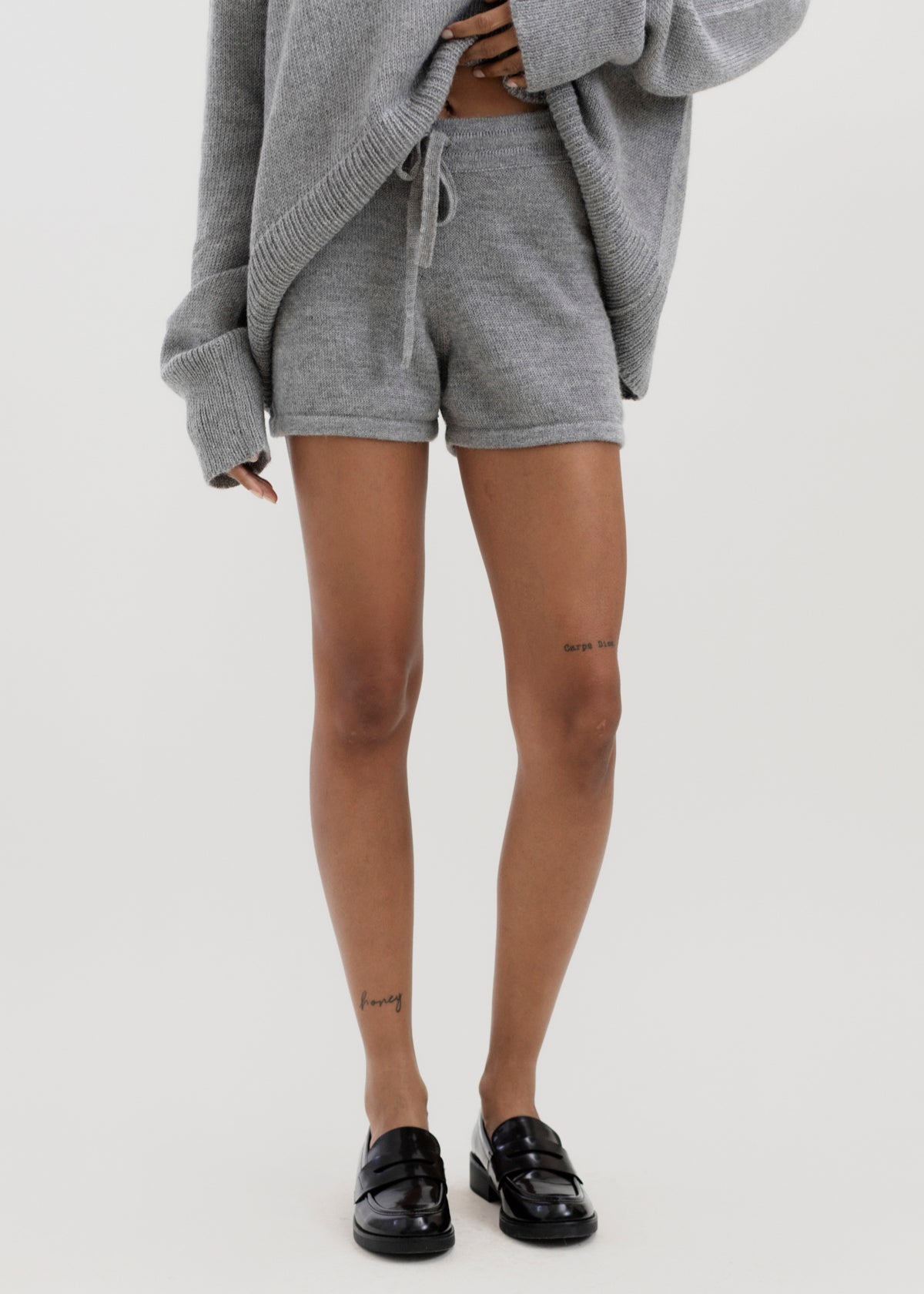 Cove Shorts in Mist Grey, baby alpaca knit shorts by Ahblo, worn by model