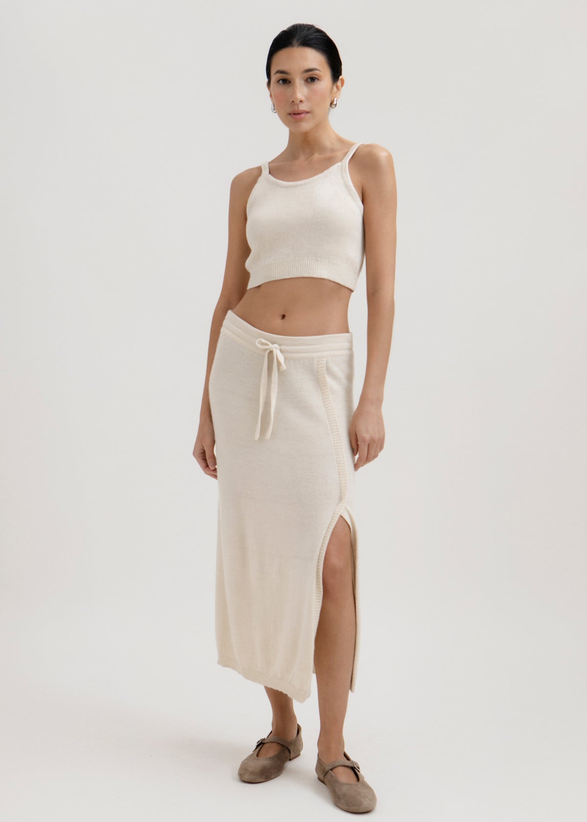 Elise Midi Skirt in Cream, alpaca knit midi skirt by Ahblo, worn by model