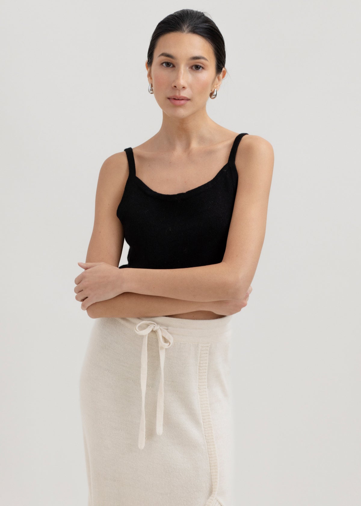 Halo Top in Black, alpaca knit cropped top by Ahblo, worn by model