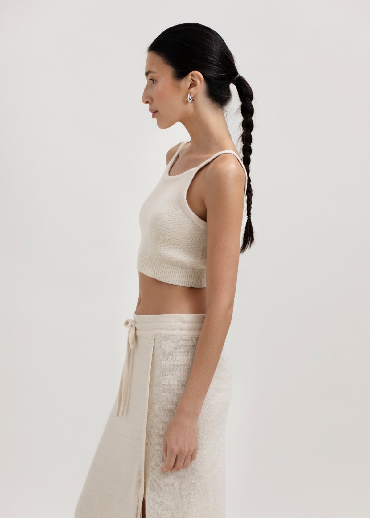 Halo Top in Cream, alpaca knit cropped top by Ahblo, worn by model