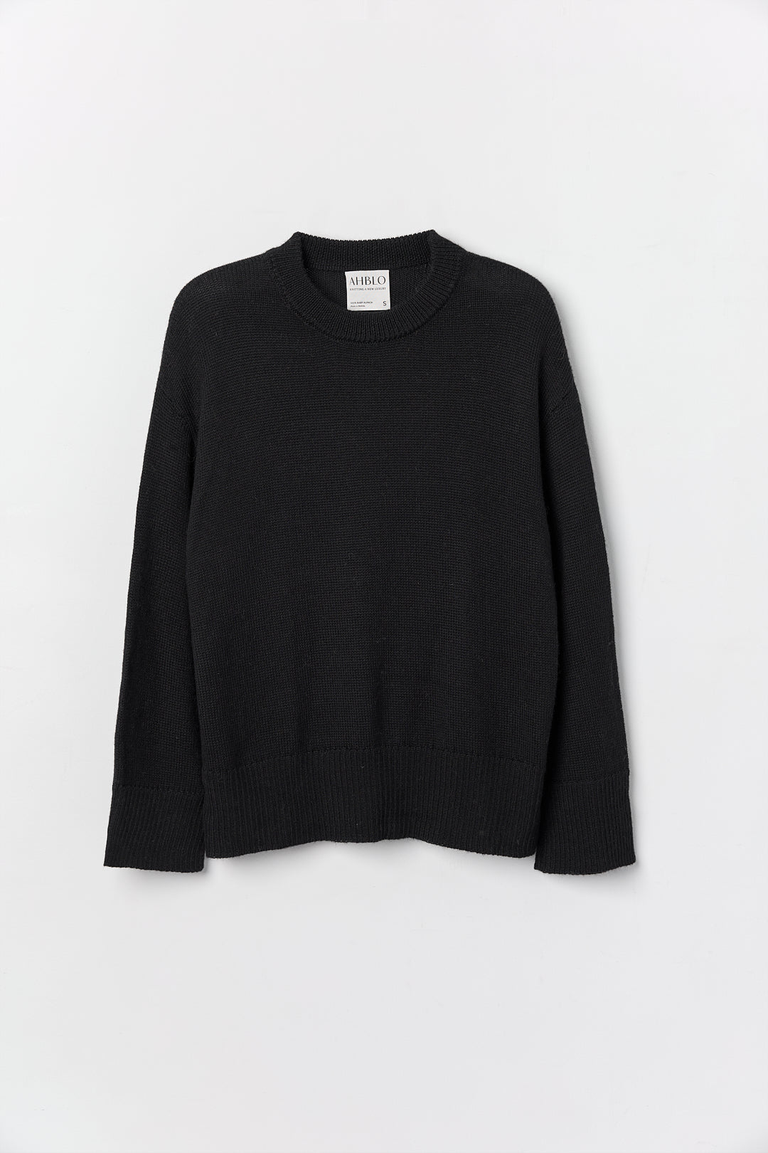 Haven Crew in Black, baby alpaca crew-neck sweater by Ahblo, flat lay