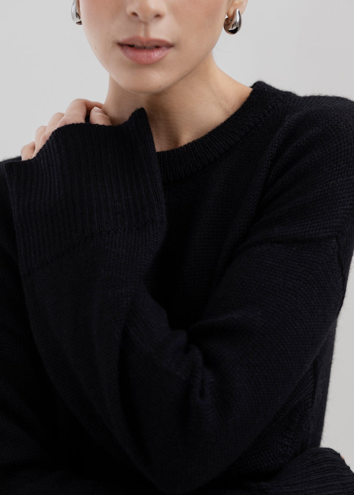 Haven Crew in Black, baby alpaca crew-neck sweater by Ahblo, worn by model