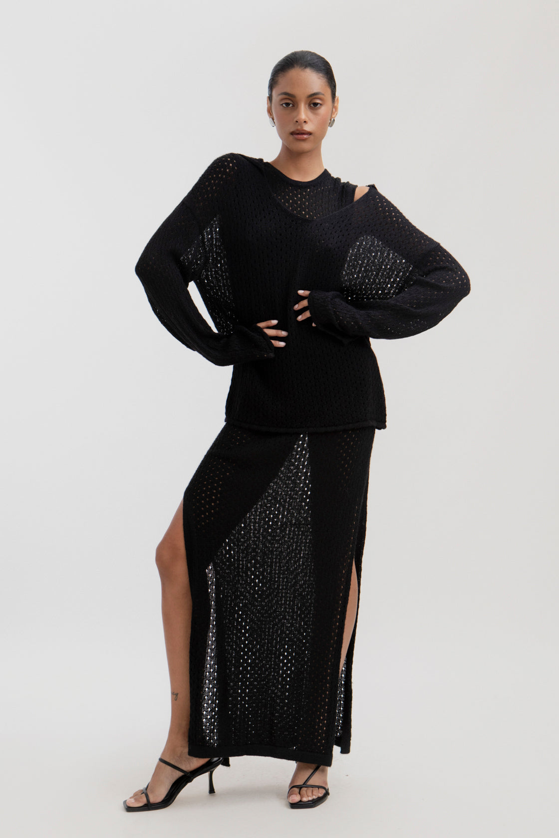 Haze Sweater in Black, baby alpaca crochet-knit sweater by Ahblo, worn by model