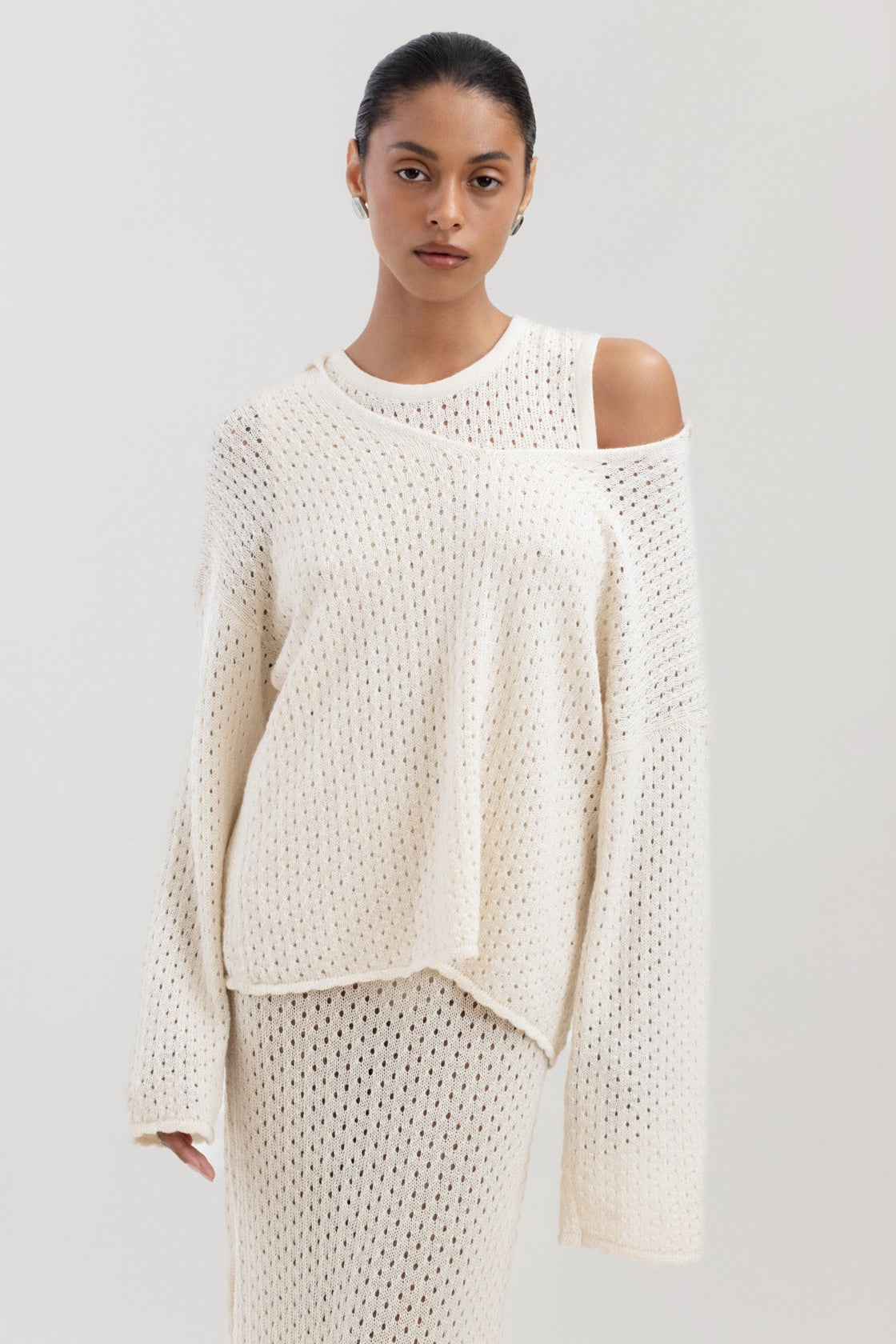 Haze Sweater in Cream, baby alpaca crochet-knit sweater by Ahblo, worn by model