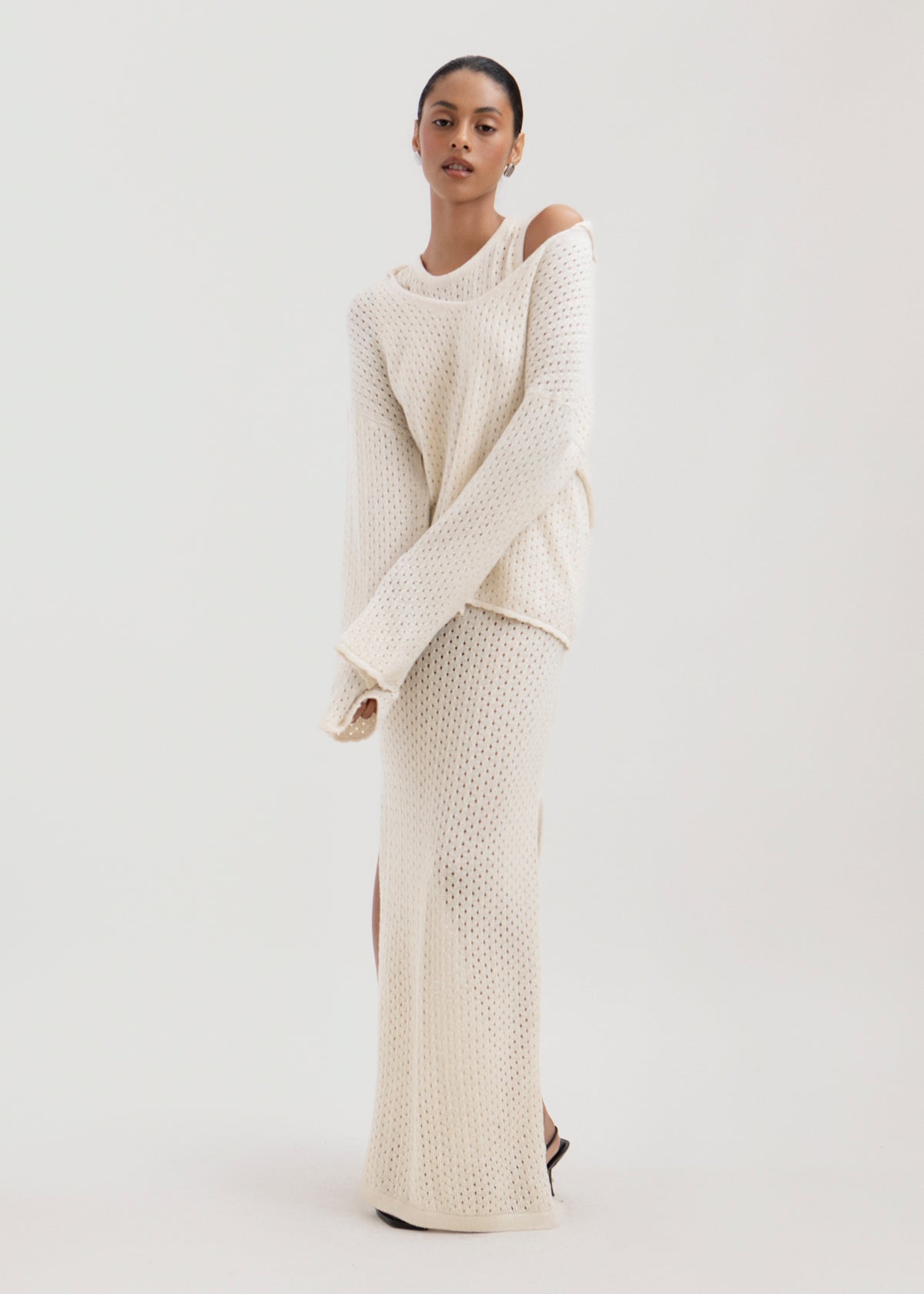 Haze Sweater in Cream, baby alpaca crochet-knit sweater by Ahblo, worn by model