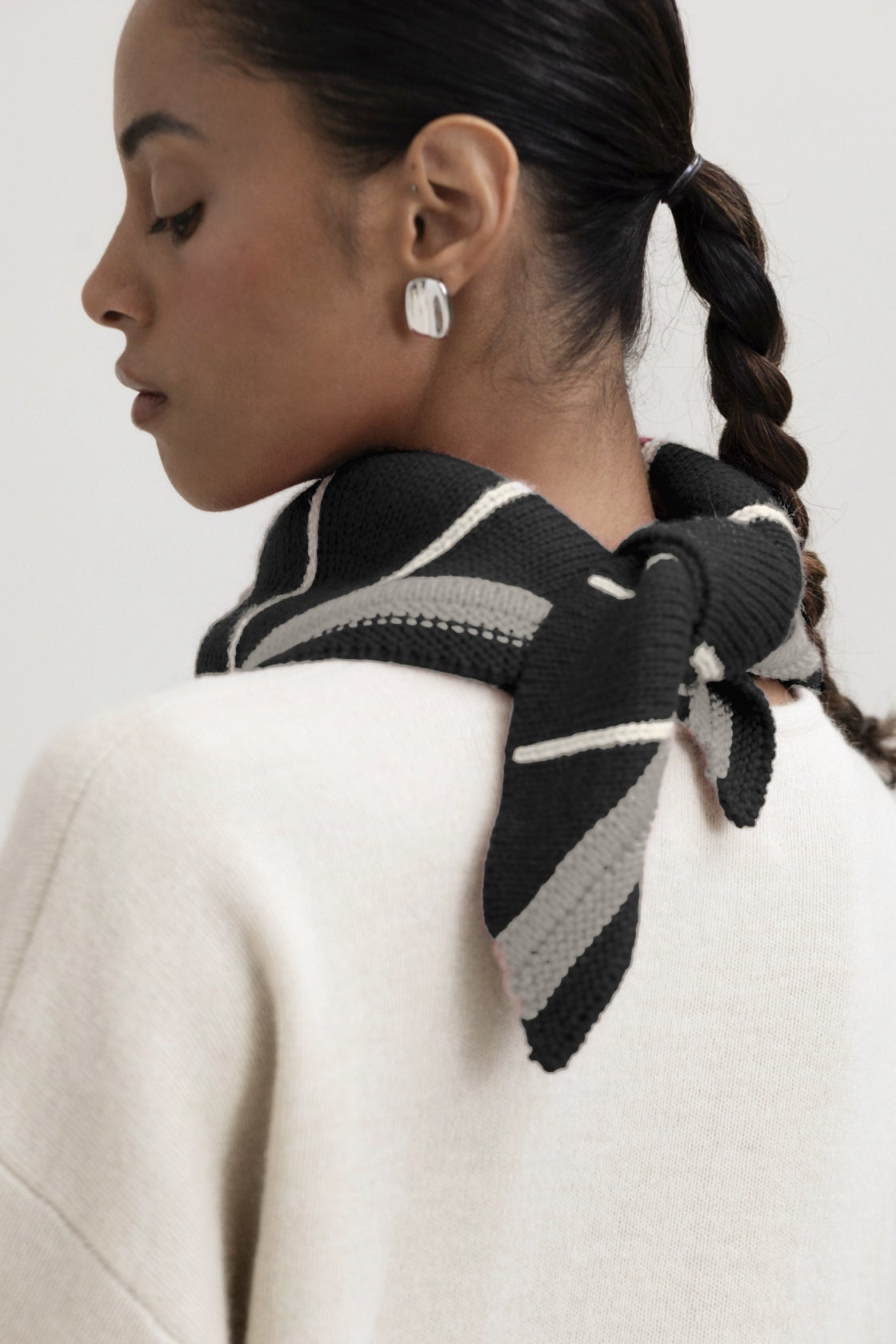 Lina Scarf in Grey, reversible striped baby alpaca triangle scarf by Ahblo, worn by model