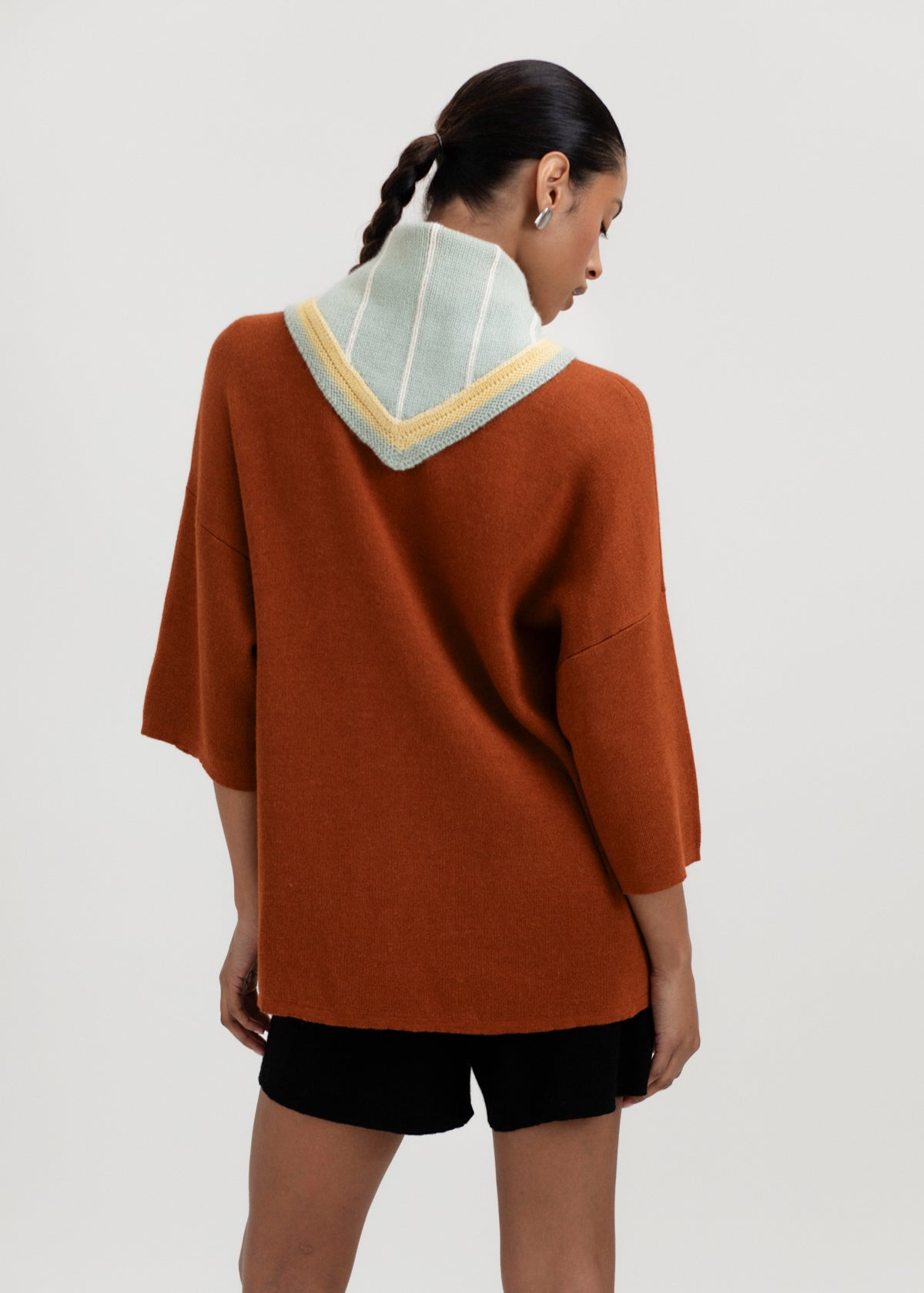 Lina Scarf in Sage, reversible striped baby alpaca triangle scarf by Ahblo, worn by model