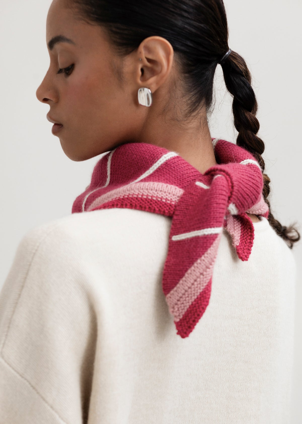 Lina Scarf in Wild Rose, reversible striped baby alpaca triangle scarf by Ahblo, worn by model