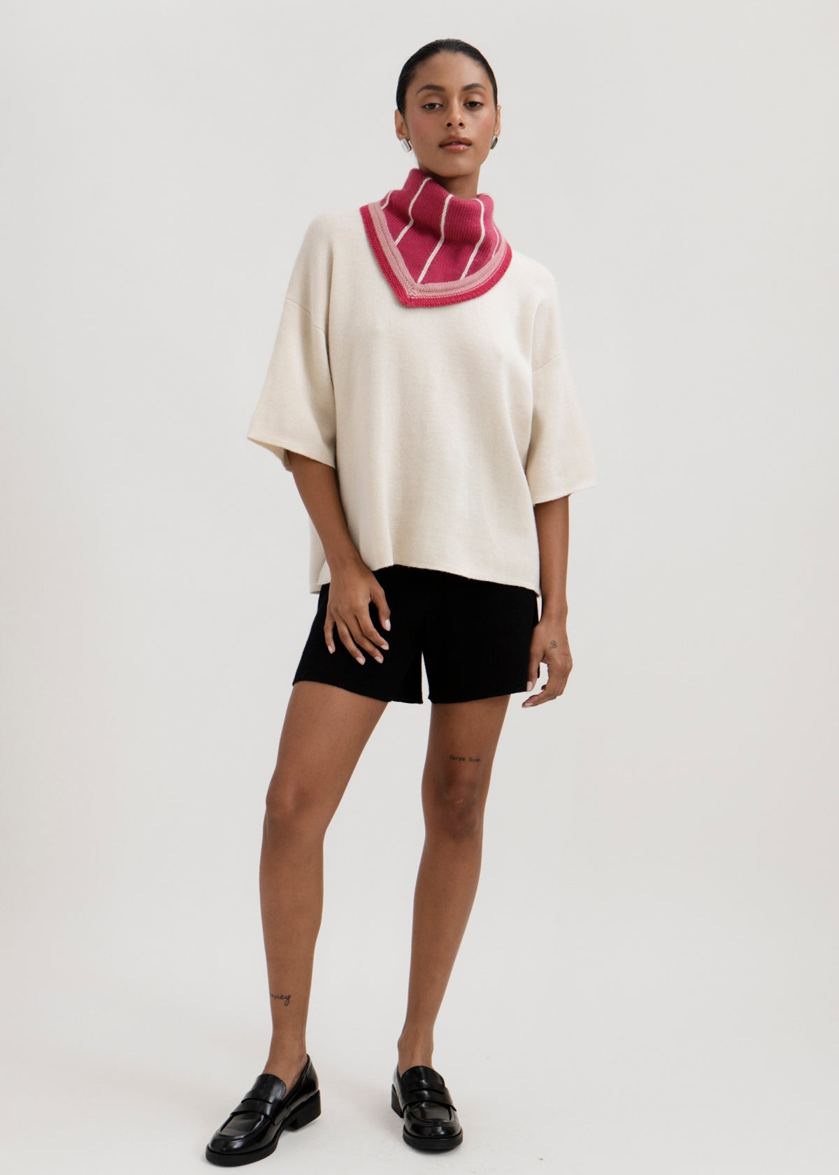Lina Scarf in Wild Rose, reversible striped baby alpaca triangle scarf by Ahblo, worn by model