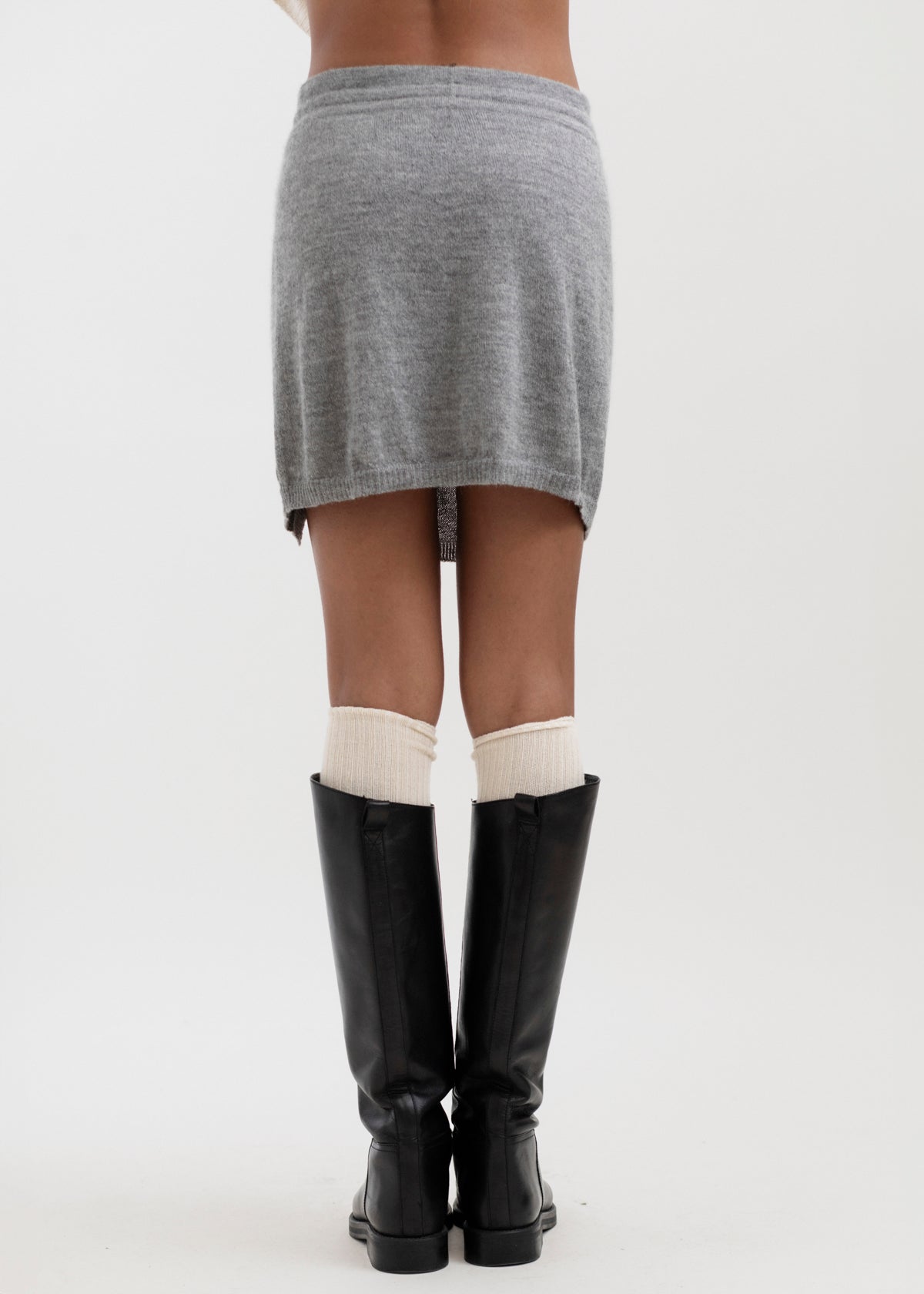 Lisa Mini Skirt in Mist Grey, baby alpaca jersey mini skirt by Ahblo, worn by model