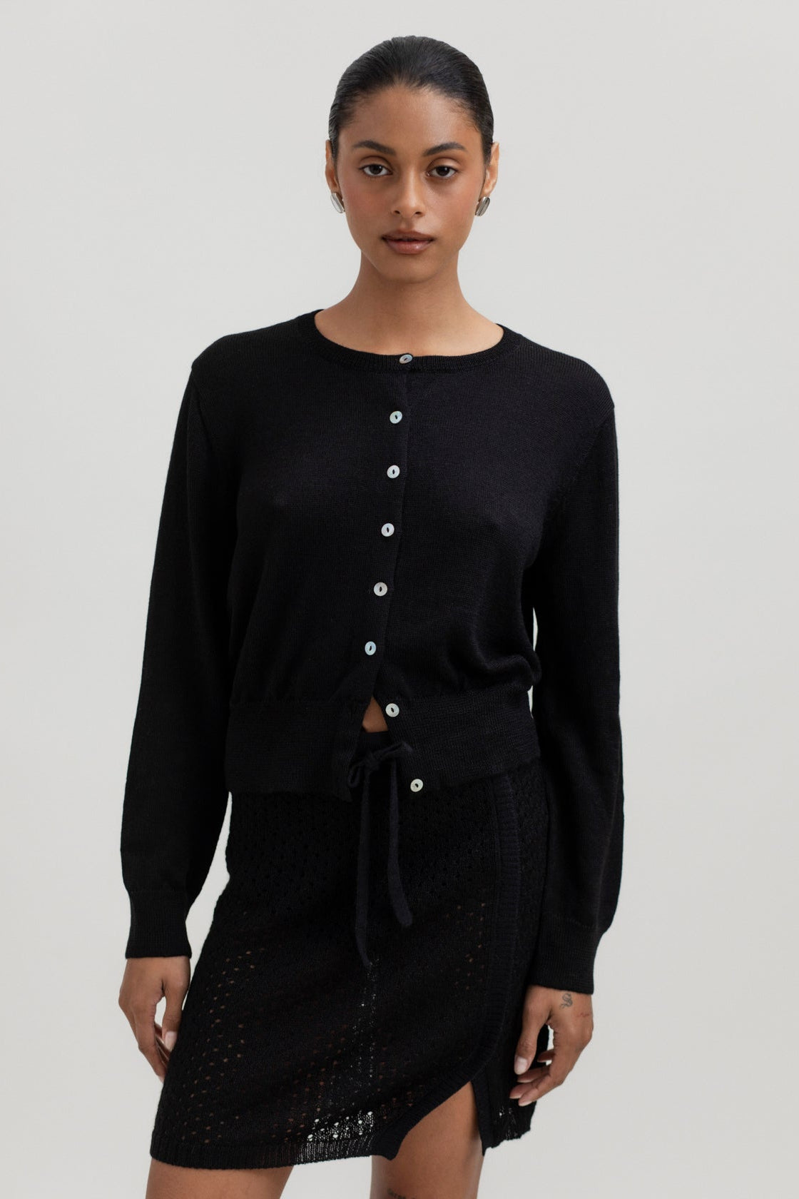 Lulu Cardigan in Black, alpaca cardigan by Ahblo, worn by model