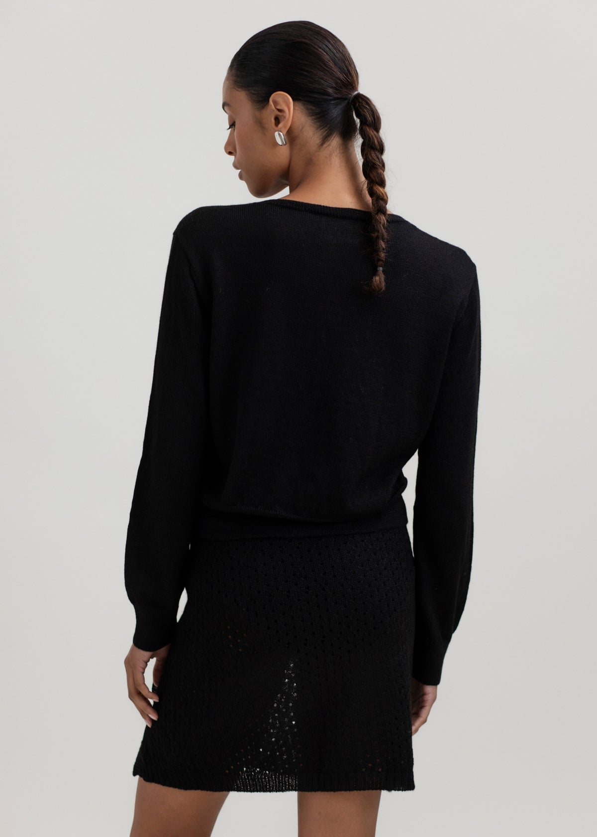 Lulu Cardigan in Black, alpaca cardigan by Ahblo, worn by model