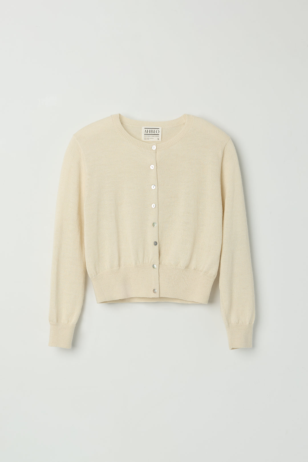 Lulu Cardigan in Cream, alpaca cardigan by Ahblo, flat lay