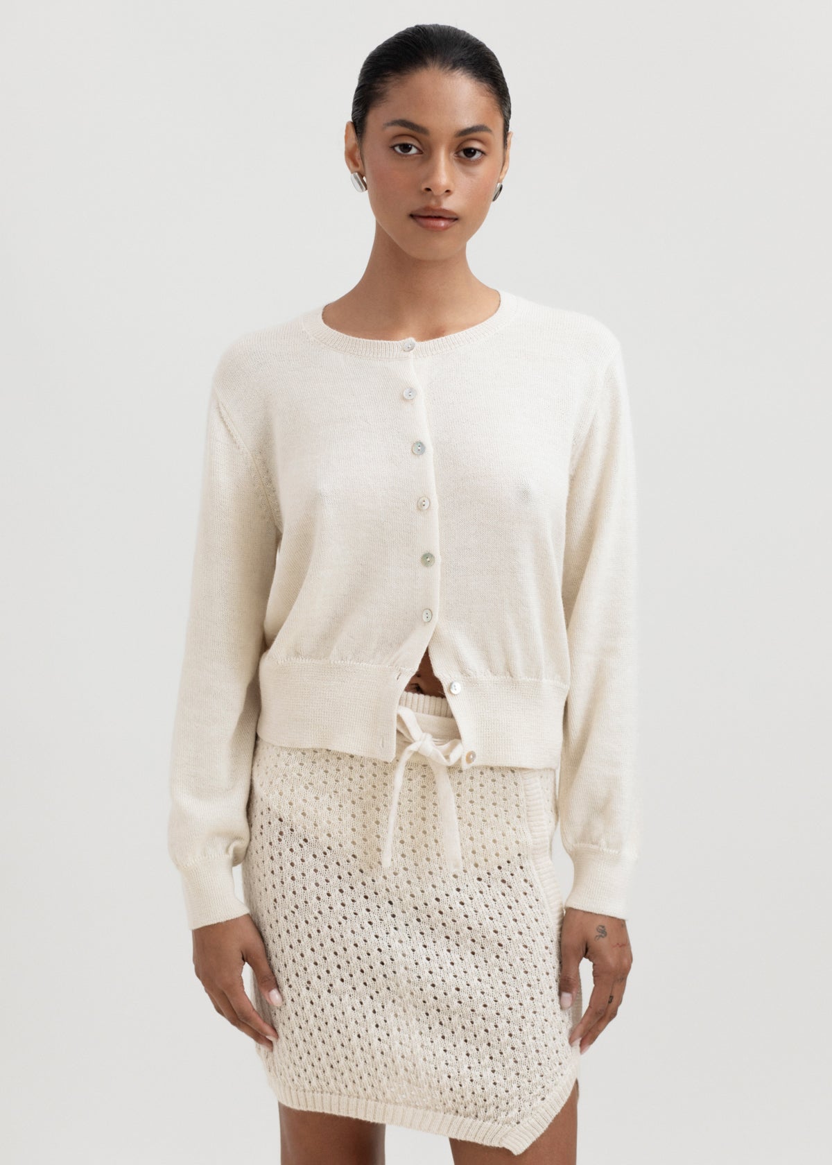 Lulu Cardigan in Cream, alpaca cardigan by Ahblo, worn by model