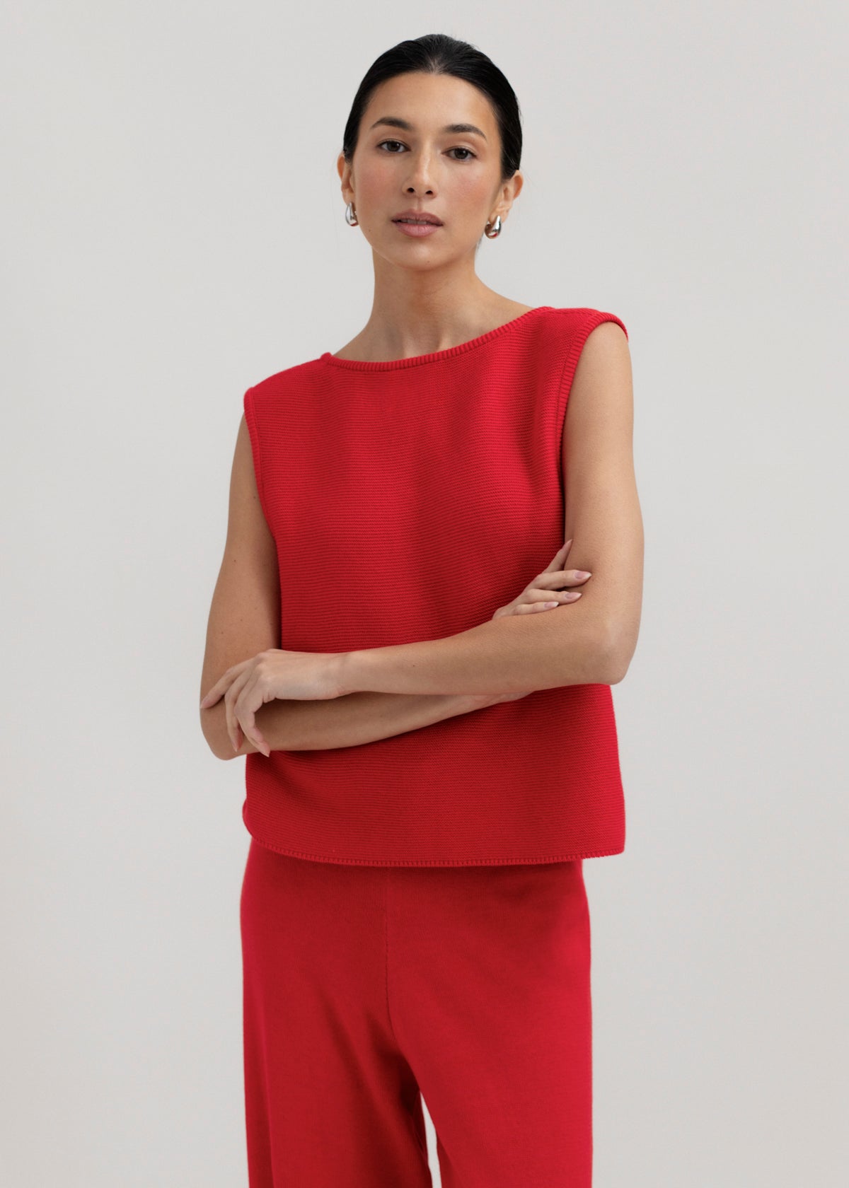 Luzia Vest in Cerise, cotton and baby alpaca knit vest by Ahblo, worn by model