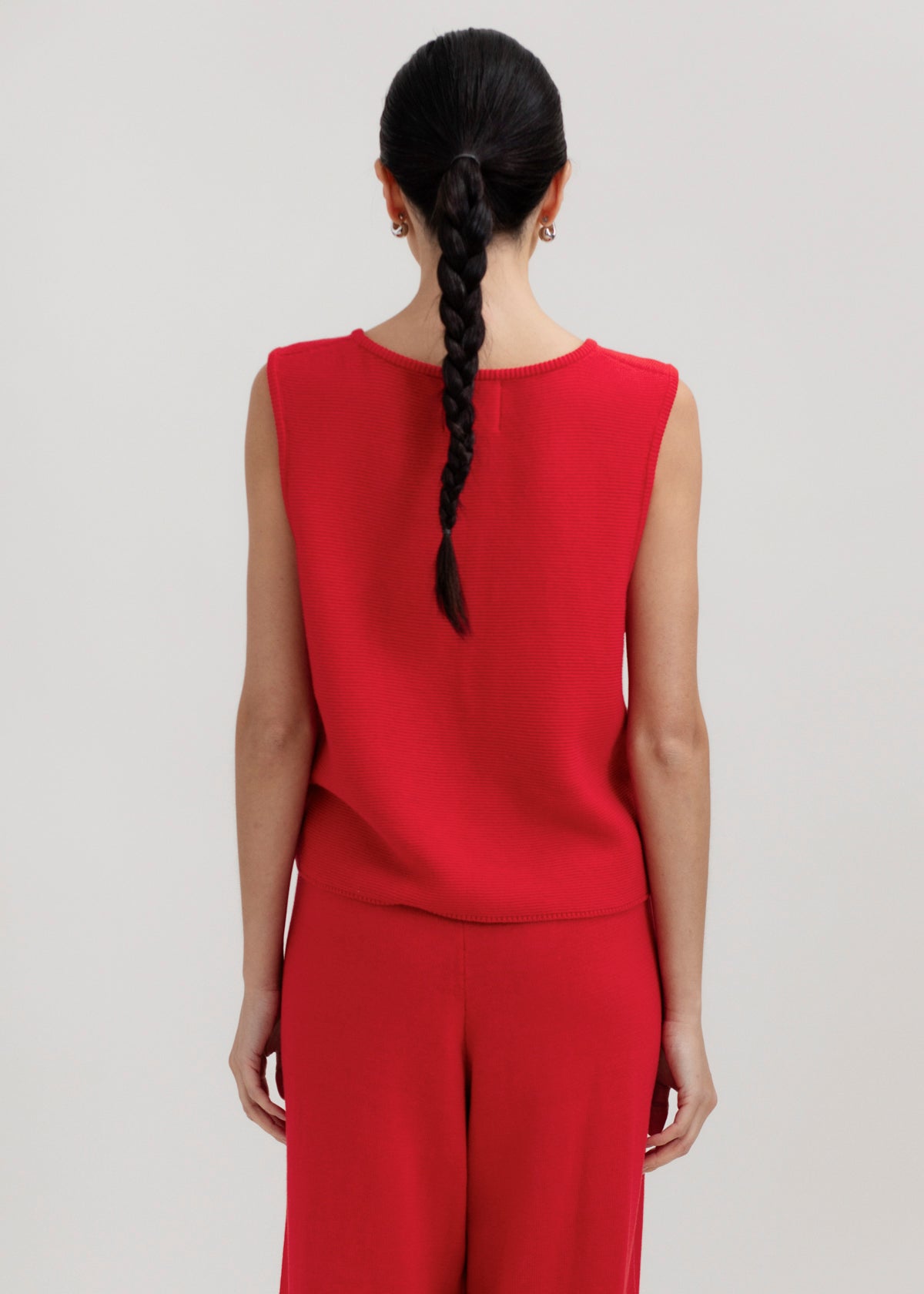 Luzia Vest in Cerise, cotton and baby alpaca knit vest by Ahblo, worn by model