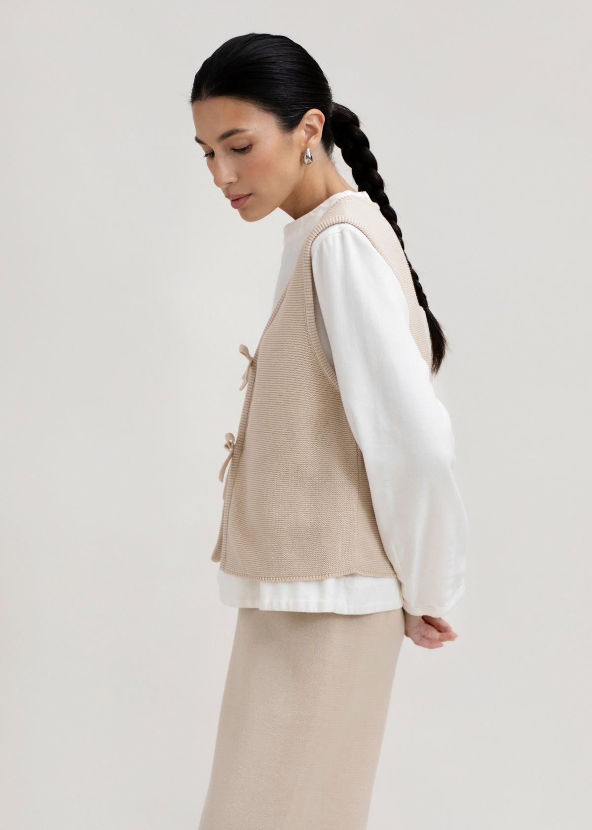 Luzia Vest in Praline, cotton and baby alpaca knit vest by Ahblo, worn by model