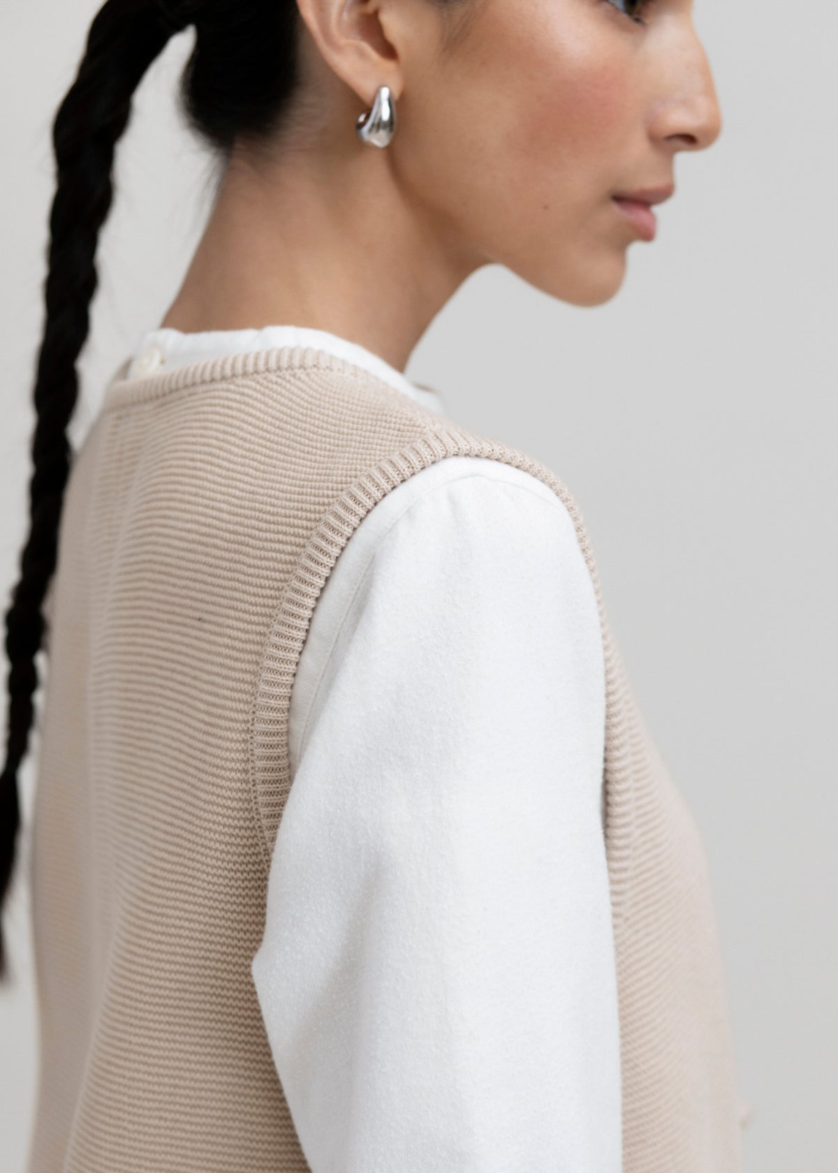Luzia Vest in Praline, cotton and baby alpaca knit vest by Ahblo, worn by model