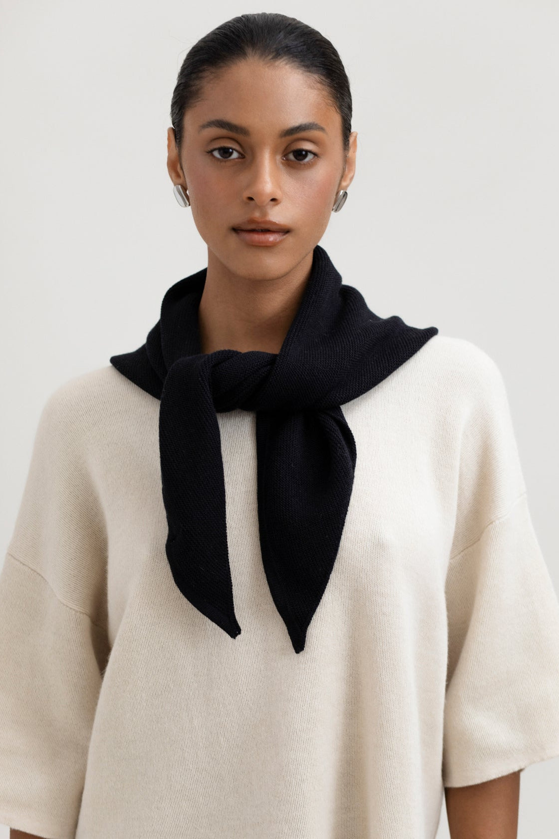 Nora Scarf in Black, cotton and baby alpaca triangle scarf by Ahblo, worn by model