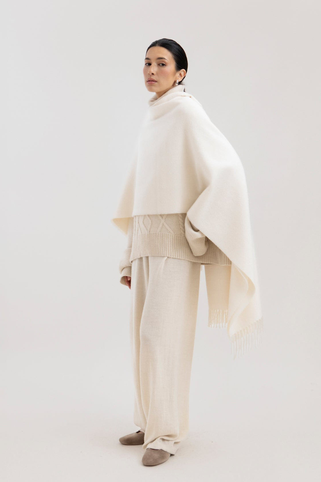 Riley Scarf in Cream, blanket-size baby alpaca scarf by Ahblo, worn by model
